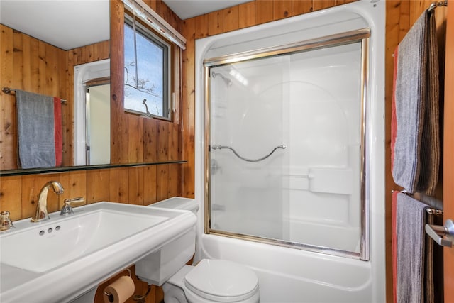 521 Fire Island Blvd, Fire Island Pines, NY 11782 - full bath featuring wood walls, a sink, toilet, and combined bath / shower with glass door