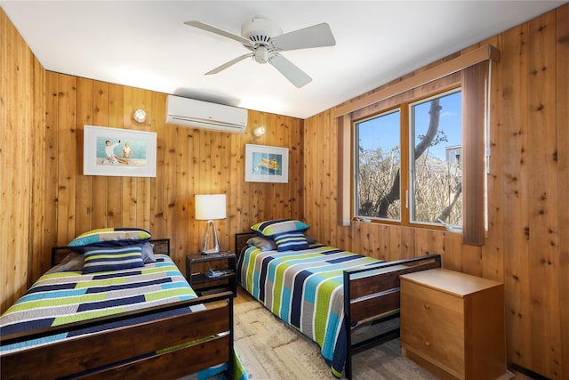521 Fire Island Blvd, Fire Island Pines, NY 11782 - bedroom featuring a wall unit AC, wooden walls, a ceiling fan, and wood finished floors