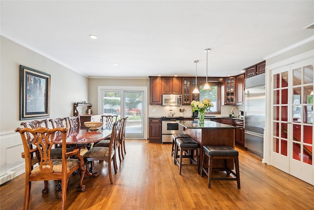 4 Valley Rd, Syosset, NY 11791 - dining area featuring crown molding, light wood-style flooring, and recessed lighting