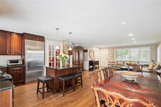 4 Valley Rd, Syosset, NY 11791 - dining room with light wood-style floors, ornamental molding, and recessed lighting
