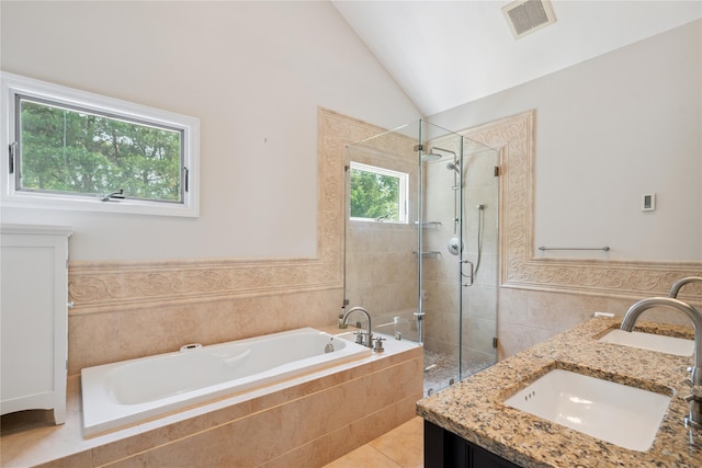 4 Valley Rd, Syosset, NY 11791 - full bath featuring a garden tub, a shower stall, double vanity, vaulted ceiling, and tile walls