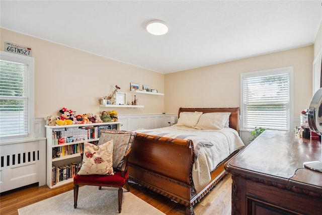 4 Valley Rd, Syosset, NY 11791 - bedroom featuring a wainscoted wall and wood finished floors