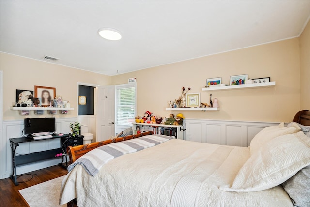 4 Valley Rd, Syosset, NY 11791 - bedroom with a decorative wall, dark wood-type flooring, and wainscoting