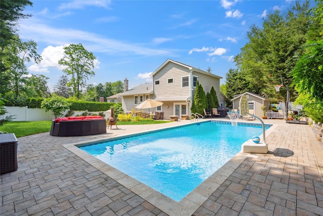 4 Valley Rd, Syosset, NY 11791 - view of pool featuring an outdoor living space, a patio, a fenced backyard, and a shed