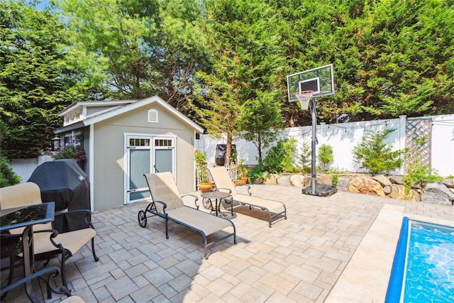 4 Valley Rd, Syosset, NY 11791 - fenced backyard with an outdoor structure, a patio area, and grilling area