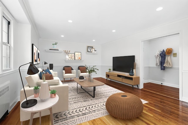 11 Sentry Pl Unit 2C, Scarsdale, NY 10583 - living area featuring radiator heating unit, wood finished floors, ornamental molding, and recessed lighting