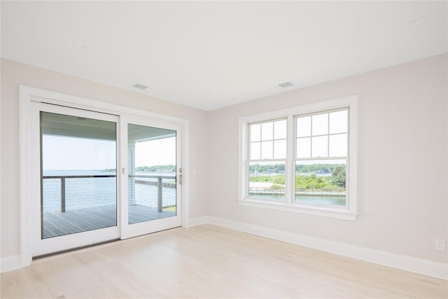 7 Convent Ln, Center Moriches, NY 11934 - unfurnished room featuring light wood-type flooring and a water view