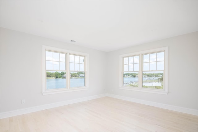 7 Convent Ln, Center Moriches, NY 11934 - empty room featuring light wood-style floors and a water view