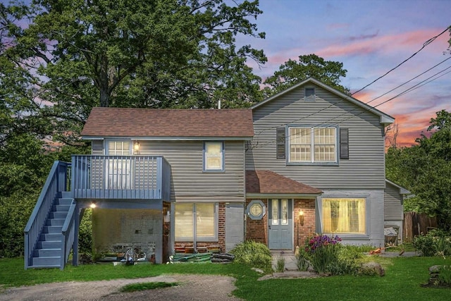 484 Rte 211 W, Middletown, NY 10940 - back of property at dusk featuring stairway, a yard, a deck, and a shingled roof
