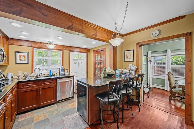 484 Rte 211 W, Middletown, NY 10940 - kitchen featuring dishwasher, a kitchen breakfast bar, ornamental molding, pendant lighting, and a sink