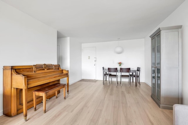 2 Bay Club Dr Unit 2B, Bayside, NY 11360 - living area featuring light wood-style floors and baseboards