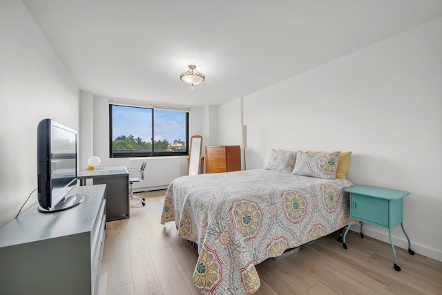 2 Bay Club Dr Unit 2B, Bayside, NY 11360 - bedroom featuring light wood-type flooring and baseboards