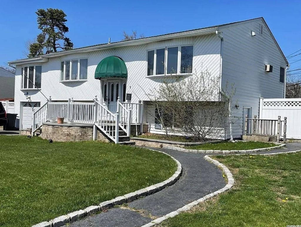 1 Winthrop St, Islip, NY 11751 - raised ranch featuring a garage