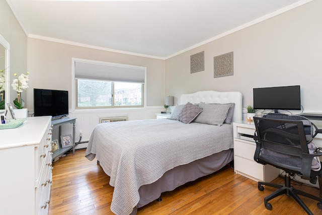 2449 Union Blvd Unit 36-A, Islip, NY 11751 - bedroom with light wood-type flooring, a desk, crown molding, and a baseboard heating unit