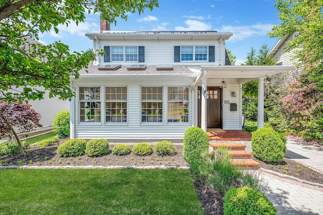 85 Fairmount St, Huntington, NY 11743 - traditional-style home featuring a chimney and a front lawn