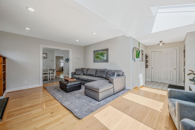 85 Fairmount St, Huntington, NY 11743 - living area featuring light wood finished floors, baseboards, recessed lighting, and a skylight