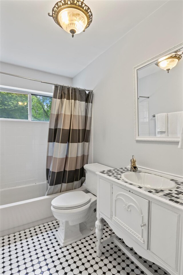 319 Thompson St, Port Jefferson, NY 11777 - full bathroom with toilet, vanity, and shower / bath combo
