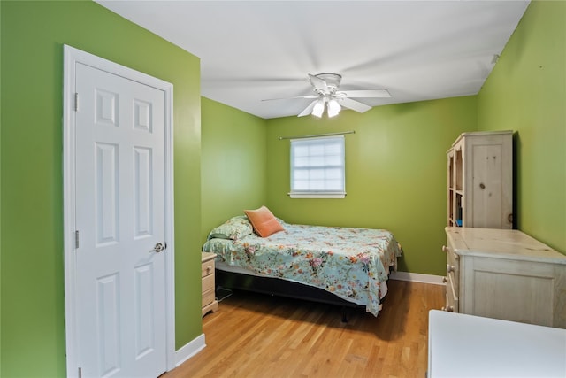 319 Thompson St, Port Jefferson, NY 11777 - bedroom with wood finished floors, baseboards, and ceiling fan
