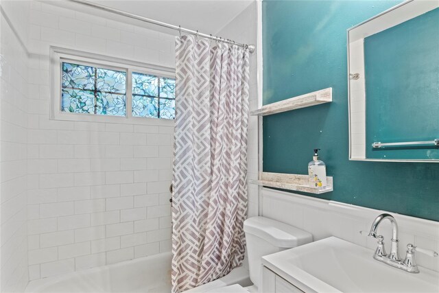 319 Thompson St, Port Jefferson, NY 11777 - full bath with toilet, wainscoting, shower / tub combo, and vanity