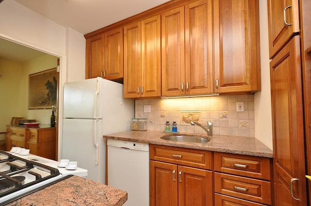 230 Garth Rd Unit 6C1, Scarsdale, NY 10583 - kitchen with dishwasher, a sink, brown cabinetry, and decorative backsplash