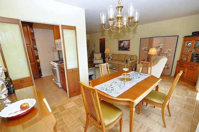 230 Garth Rd Unit 6C1, Scarsdale, NY 10583 - dining area featuring a chandelier