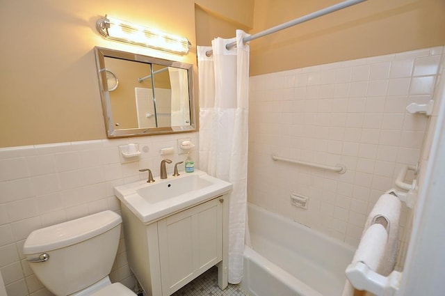 230 Garth Rd Unit 6C1, Scarsdale, NY 10583 - bathroom featuring shower / tub combo with curtain, tile walls, vanity, toilet, and wainscoting