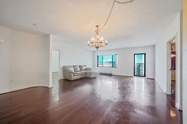136 Bch 117th St Unit 6H, Rockaway Park, NY 11694 - living room with a chandelier, dark wood-style floors, and baseboards