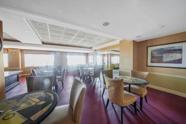 136 Bch 117th St Unit 6H, Rockaway Park, NY 11694 - dining room featuring healthy amount of natural light and a wainscoted wall