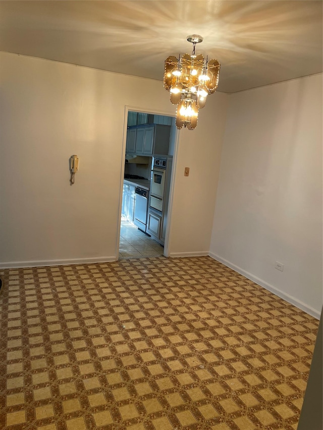 29-09 137th St Unit 1D, Flushing, NY 11354 - empty room featuring baseboards and a chandelier