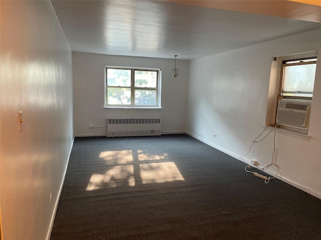29-09 137th St Unit 1D, Flushing, NY 11354 - carpeted empty room with radiator heating unit, baseboards, and cooling unit
