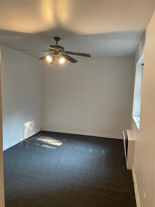 29-09 137th St Unit 1D, Flushing, NY 11354 - carpeted spare room featuring a ceiling fan and baseboards