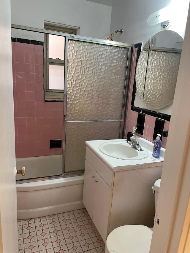 29-09 137th St Unit 1D, Flushing, NY 11354 - full bath with toilet, vanity, tile patterned flooring, and enclosed tub / shower combo