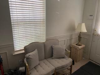 28 Torrey Pine Ln, Bay Shore, NY 11706 - sitting room featuring a decorative wall and a wainscoted wall