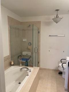 28 Torrey Pine Ln, Bay Shore, NY 11706 - bathroom featuring a garden tub, a shower stall, and tile patterned flooring