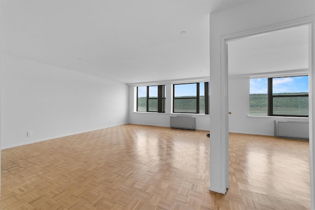 23 Water Grant St Unit 7N, Yonkers, NY 10701 - empty room featuring baseboards and radiator heating unit