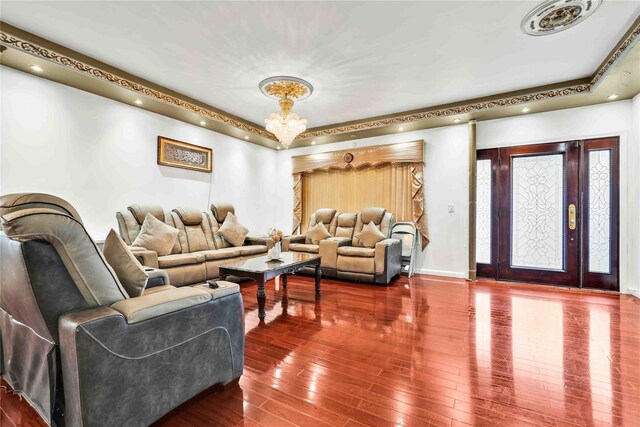 114-11 86th Ave, Richmond Hill North, NY 11418 - living room with hardwood / wood-style floors, a tray ceiling, a chandelier, and baseboards