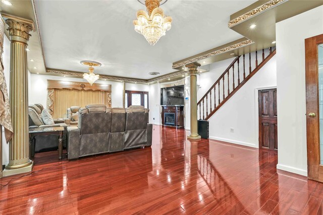 114-11 86th Ave, Richmond Hill North, NY 11418 - living room featuring a chandelier, ornate columns, wood finished floors, and baseboards