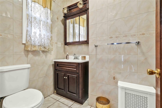 114-11 86th Ave, Richmond Hill North, NY 11418 - bathroom featuring tile walls, toilet, vanity, and tile patterned floors