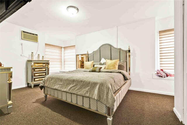 114-11 86th Ave, Richmond Hill North, NY 11418 - bedroom with dark carpet, baseboards, and a wall unit AC