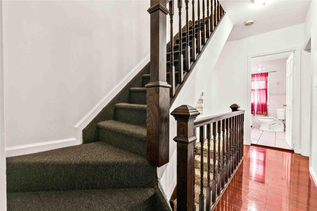 114-11 86th Ave, Richmond Hill North, NY 11418 - stairs featuring wood finished floors and baseboards