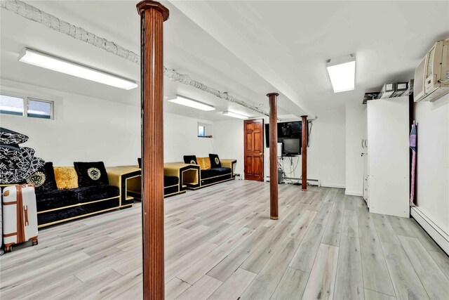 114-11 86th Ave, Richmond Hill North, NY 11418 - basement with a baseboard heating unit and light wood-type flooring