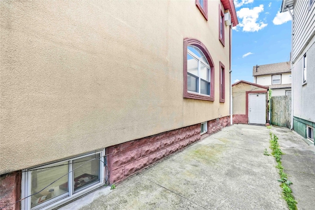 114-11 86th Ave, Richmond Hill North, NY 11418 - view of property exterior with a patio and stucco siding