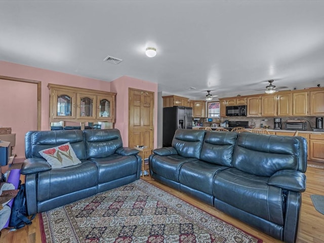 82-44 263rd St, Glen Oaks, NY 11004 - living area with light wood-style flooring and ceiling fan