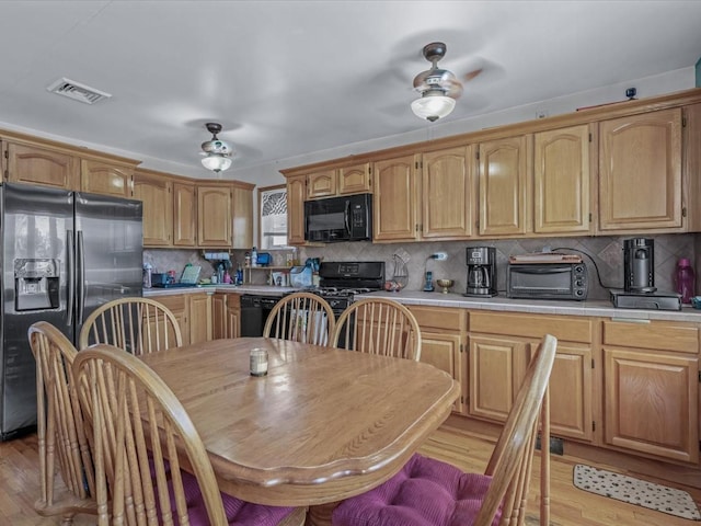 82-44 263rd St, Glen Oaks, NY 11004 - kitchen featuring black appliances, ceiling fan, and light wood-style floors