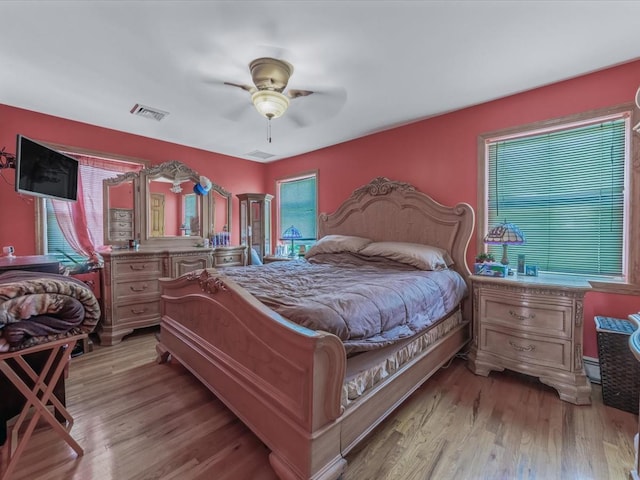82-44 263rd St, Glen Oaks, NY 11004 - bedroom with light wood-type flooring, ceiling fan, and baseboard heating