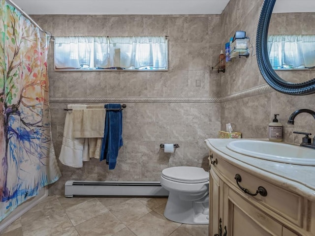 82-44 263rd St, Glen Oaks, NY 11004 - full bath featuring a baseboard radiator, vanity, tile walls, a shower with curtain, and tile patterned flooring
