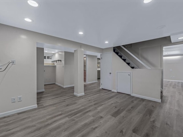 82-44 263rd St, Glen Oaks, NY 11004 - unfurnished living room featuring stairs, wood finished floors, and recessed lighting