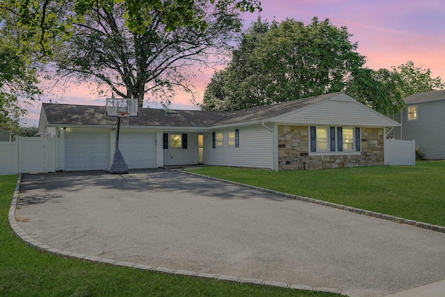 1340 Stony Brook Rd, Stony Brook, NY 11790 - single story home with a garage, driveway, and stone siding
