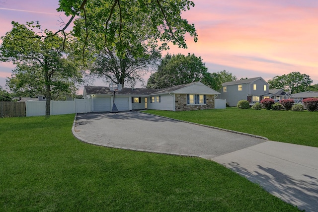 1340 Stony Brook Rd, Stony Brook, NY 11790 - view of front of home with driveway, an attached garage, and stone siding