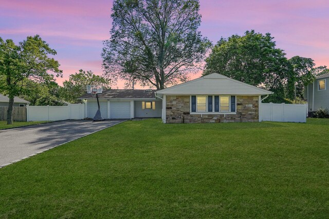1340 Stony Brook Rd, Stony Brook, NY 11790 - view of front of house with asphalt driveway, stone siding, and a garage
